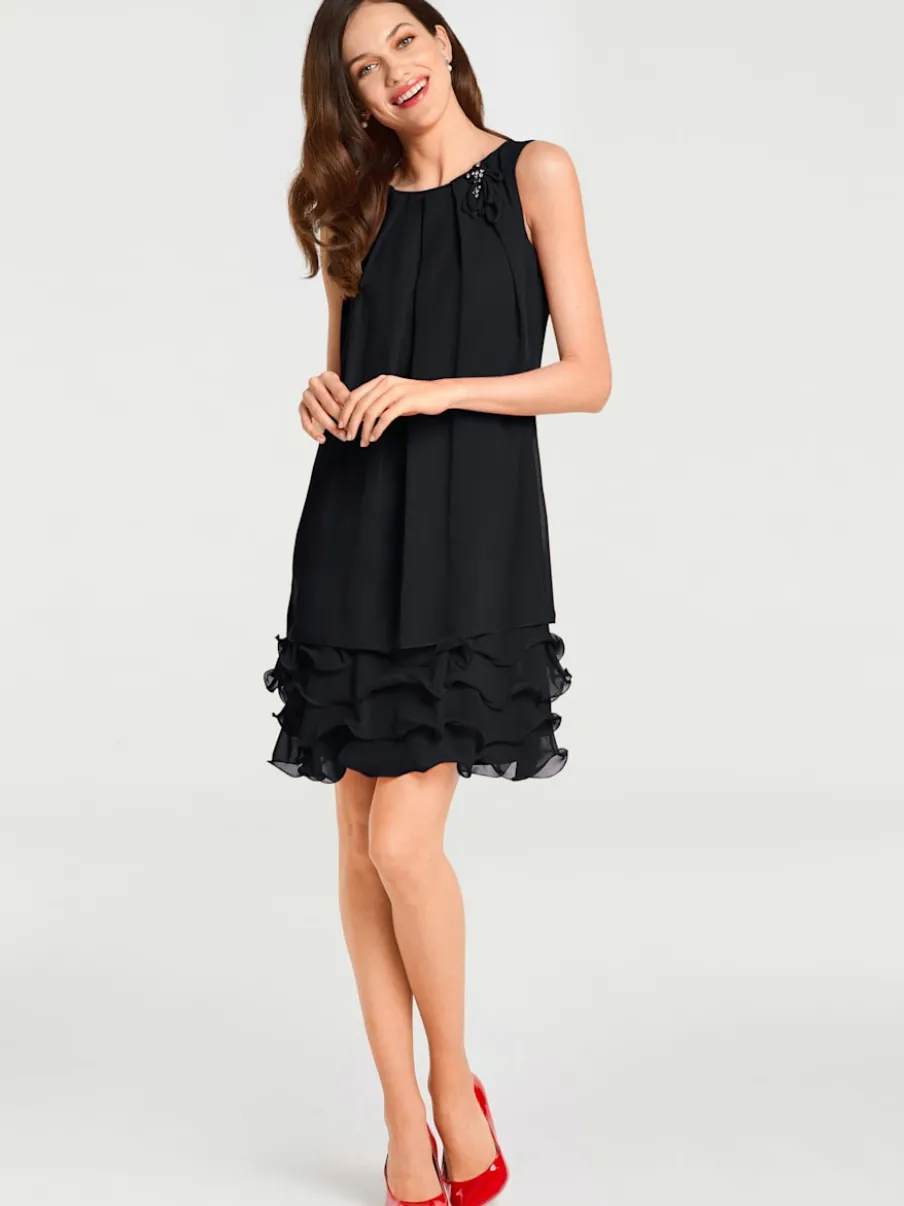 Robe de cocktail à encolure ronde et sans manches avec volants