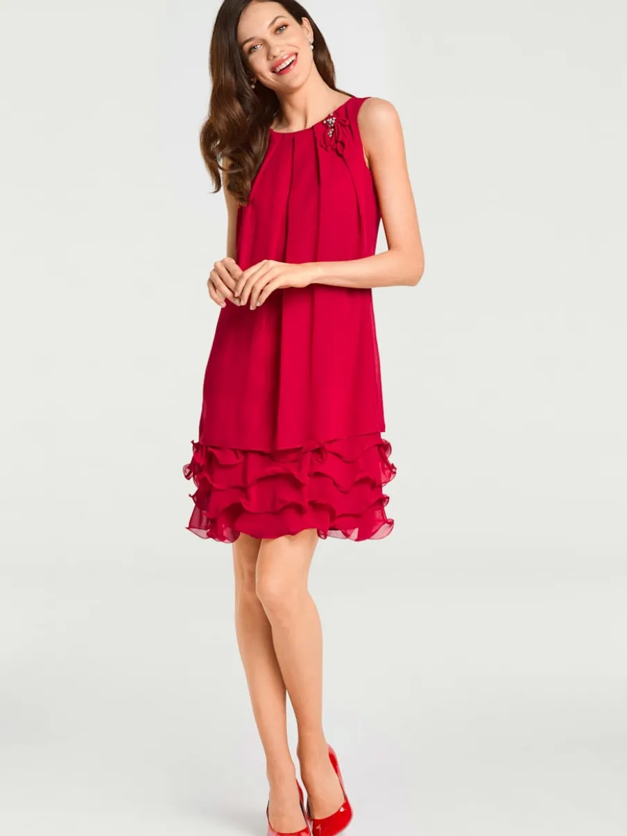 Robe de cocktail à encolure ronde et sans manches avec volants