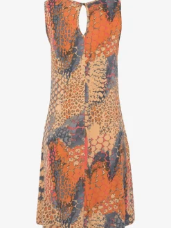 Robe de plage avec accessoire décoratif à l'encolure