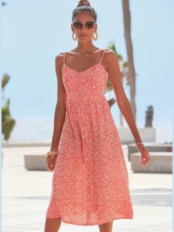 Robe d'été avec bretelles spaghetti et patte boutonnage