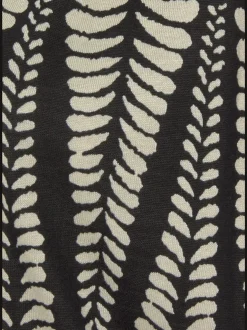 Robe en jersey à encolure en V avec motifs graphiques et empiècement smocké