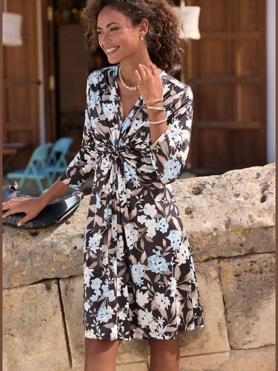 Robe en jersey à encolure en V et manches 3/4 avec nœud devant et motif floral