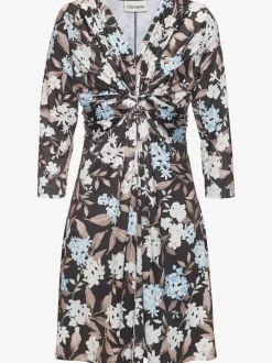 Robe en jersey à encolure en V et manches 3/4 avec nœud devant et motif floral