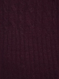 Robe en tricot col montant avec manches longues et jupe fendue