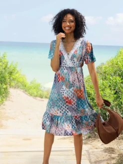 Robe imprimée à col en V avec manches courtes et ourlet volanté