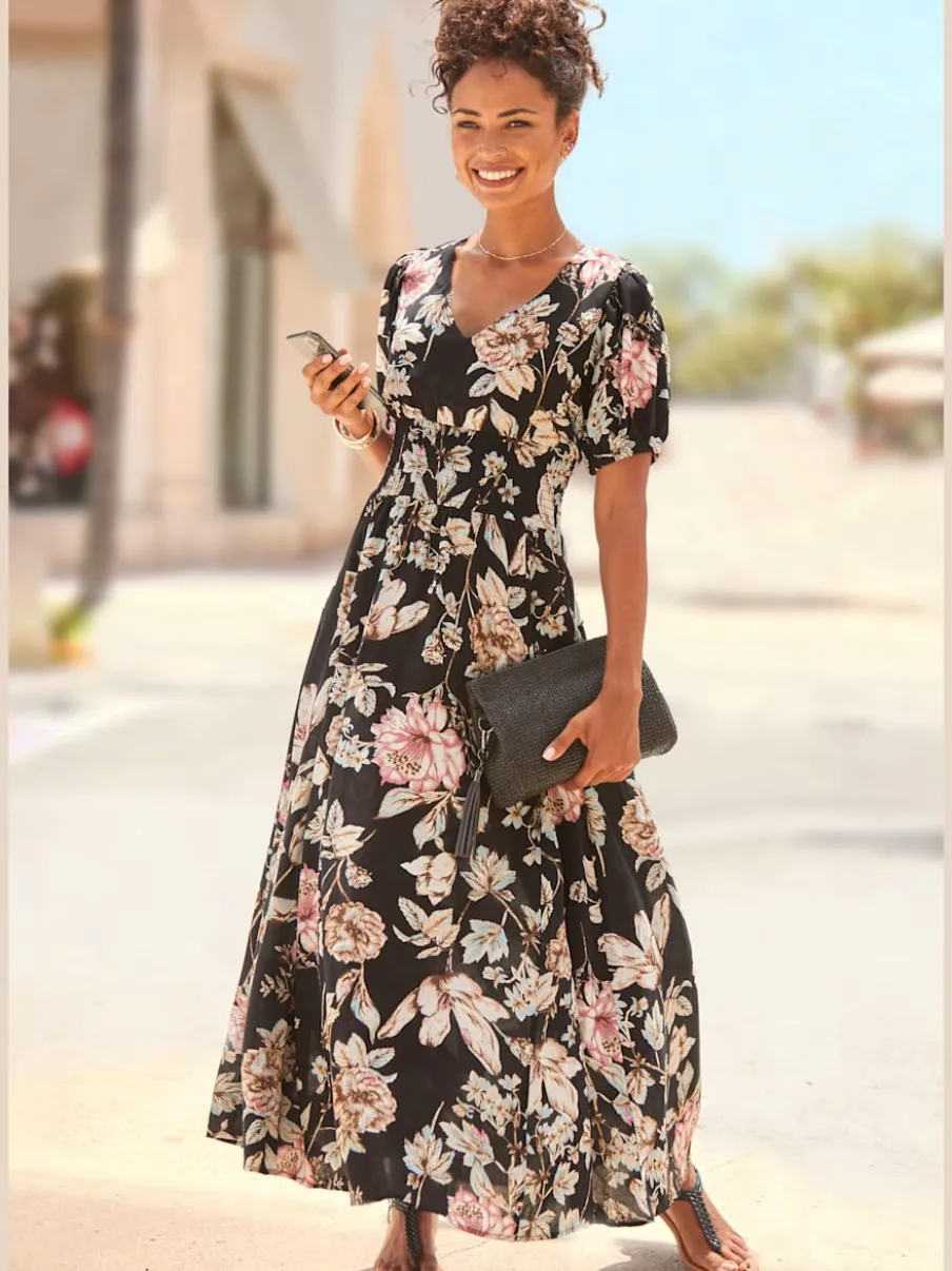 Robe longue avec col V et manches bouffantes ornée de motifs floraux