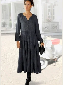 Robe longue avec encolure en v et manches longues élastiquées à motifs imprimés.