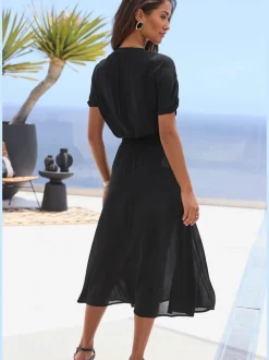 Robe mi-longue encolure ronde avec petit V et ceinture ajustable