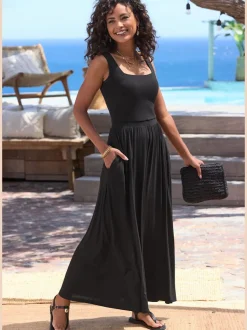 Robe mi-longue en jersey avec encolure droite et poches