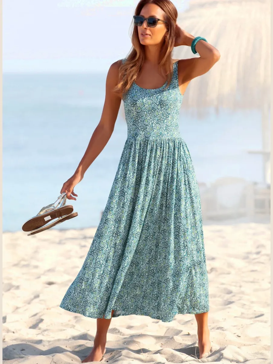 Robe mi-longue à larges bretelles avec décolleté dos