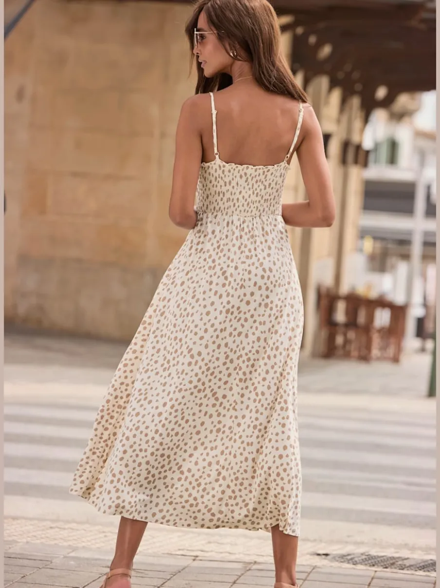 Robe mi-longue à pois avec bretelles spaghetti ajustables