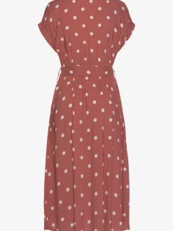 Robe mi-longue à pois avec ceinture et poches latérales