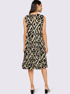 Robe évasée sans manches avec imprimé ethnique en tissu fluide