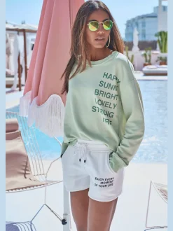 Short en matière sweat avec imprimé et poches fendues pratiques
