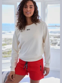 Short en matière sweat avec poches latérales zippées et ceinture élastique