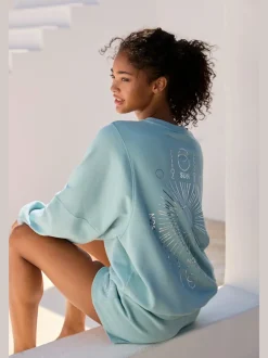 Short en matière sweat avec ruban à coulisse et poches fendues