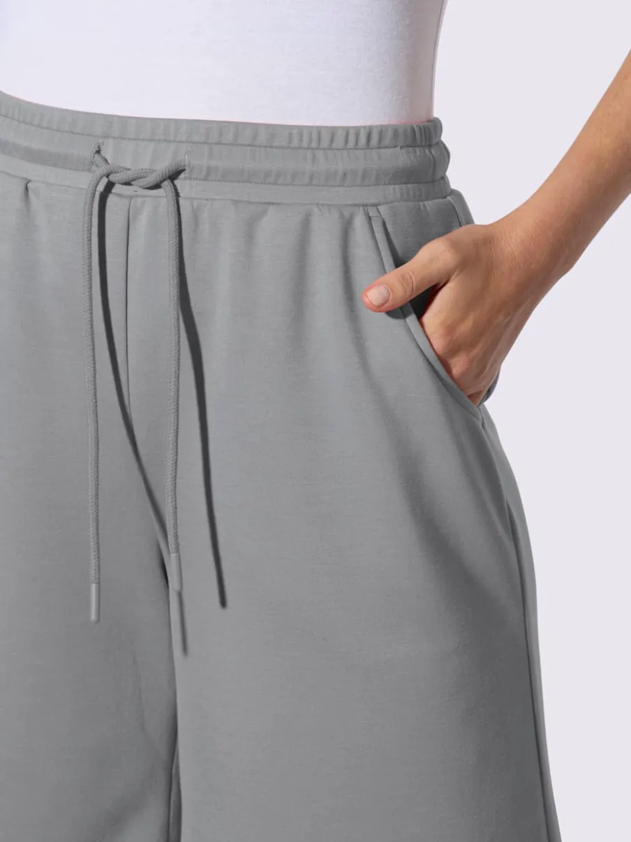 Short sweat à ceinture élastique avec poches et lien à nouer