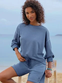 Short sweat à taille haute avec poches et broderie
