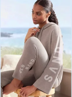 Sweat à capuche en tricot doux et élastique avec manches longues et inscriptions graphiques
