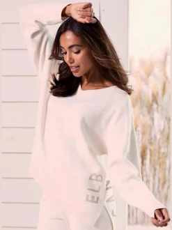 Sweater ample avec encolure en V et manches longues.