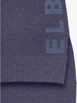 Sweater ample avec encolure en V et manches longues.