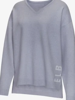 Sweater ample avec encolure en V et manches longues.