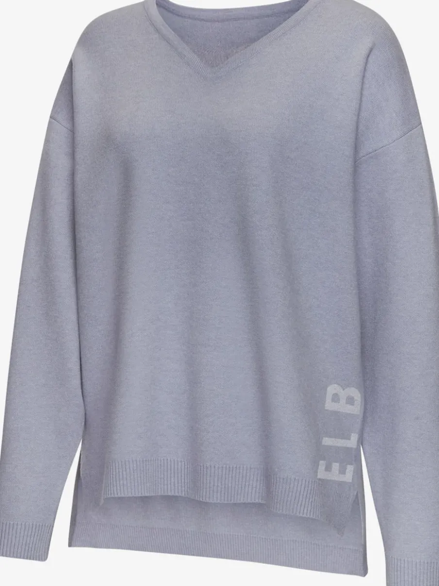 Sweater ample avec encolure en V et manches longues.