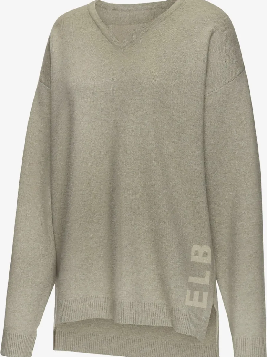 Sweater ample avec encolure en V et manches longues.