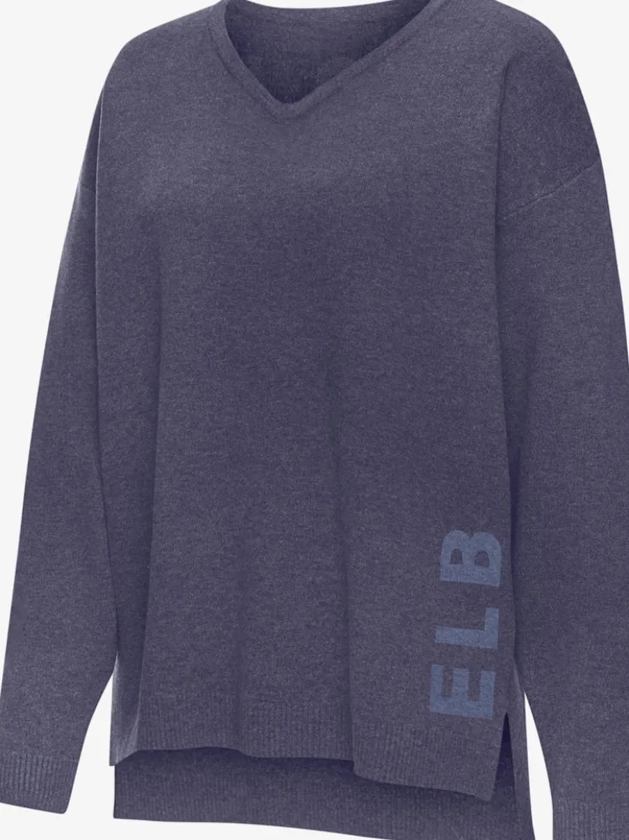 Sweater ample avec encolure en V et manches longues.