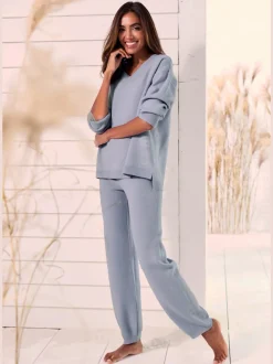 Sweater ample avec encolure en V et manches longues.