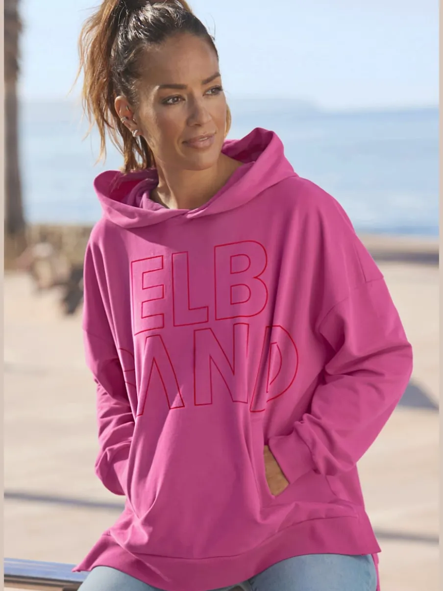 Sweatshirt à capuche large avec logo et poches.