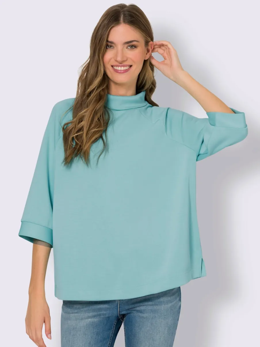 Sweatshirts en modal doux avec col montant et manches.