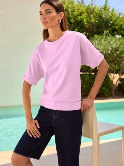 T-shirt ample avec œillets décoratifs sur manches courtes