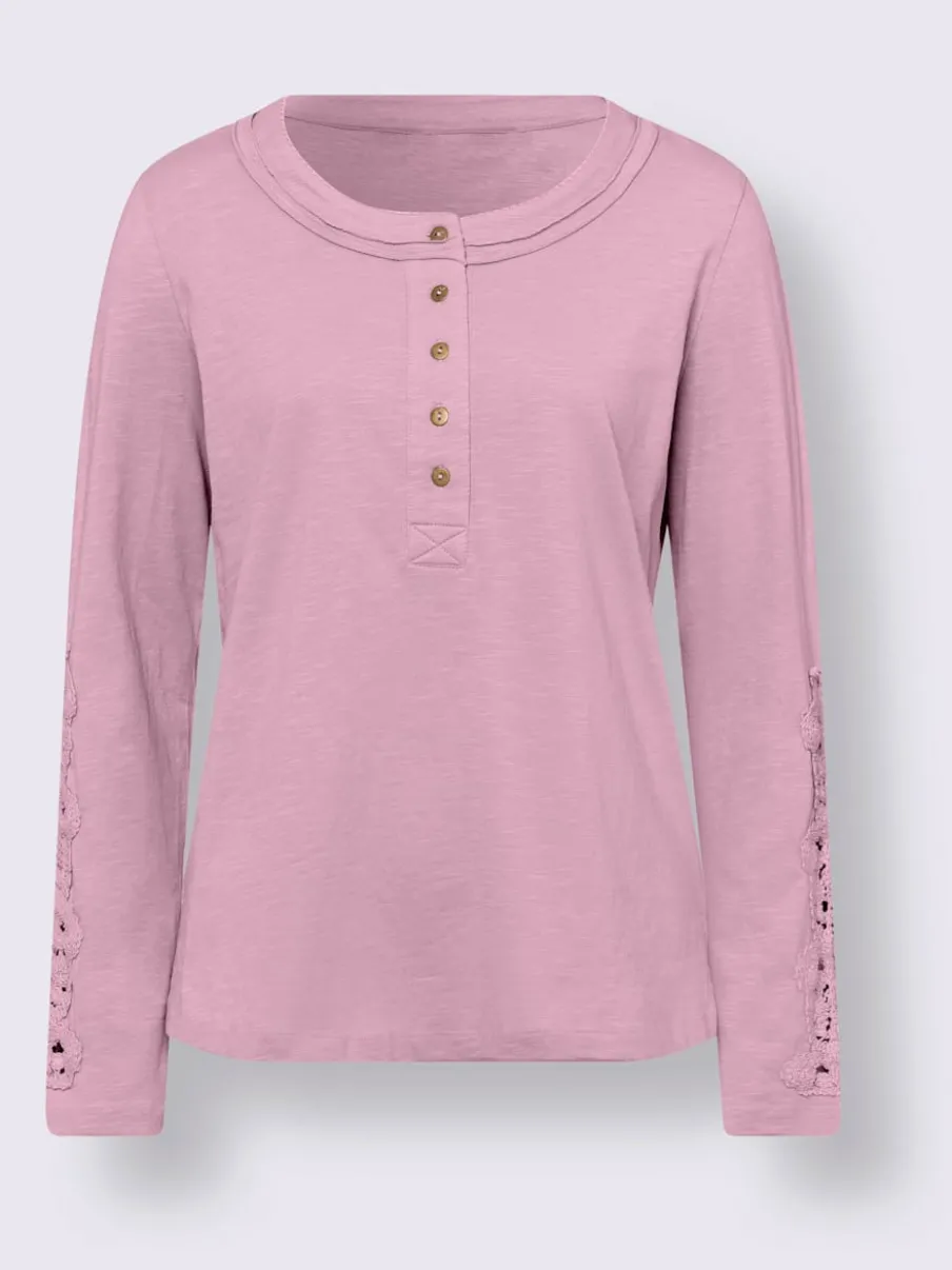 T-shirt à col rond avec délicat empiècement en dentelle et fentes latérales