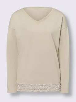 T-shirt en V avec dentelle délicate et manches longues