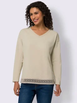 T-shirt en V avec dentelle délicate et manches longues