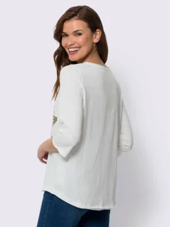 T-shirt à manches 3/4 avec motif étoilé et pierres.