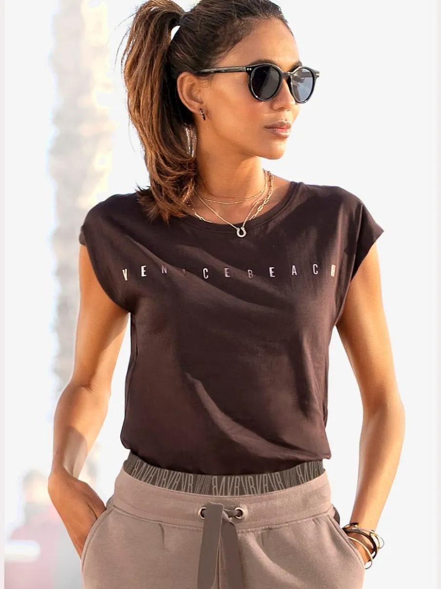 T-shirt à manches courtes avec encolure ronde et logo brillant