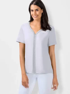 T-shirt à manches courtes avec passepoil en V et empiècements floraux