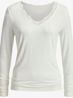 T-shirt à manches longues avec dentelle délicate à l'encolure en v