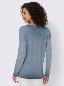 T-shirt à manches longues en coton avec imprimé feuille.