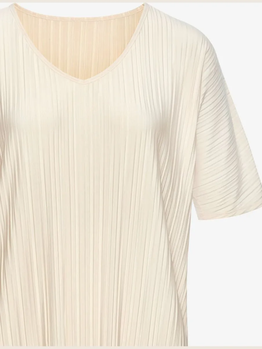 T-shirt plissé en tissu brillant avec col V et manches chauve-souris
