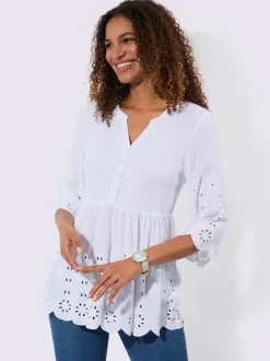 Tunique en dentelle avec empiècements et patte de boutonnage