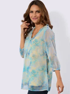 Tuniques à encolure en V avec motifs fleuris et volants