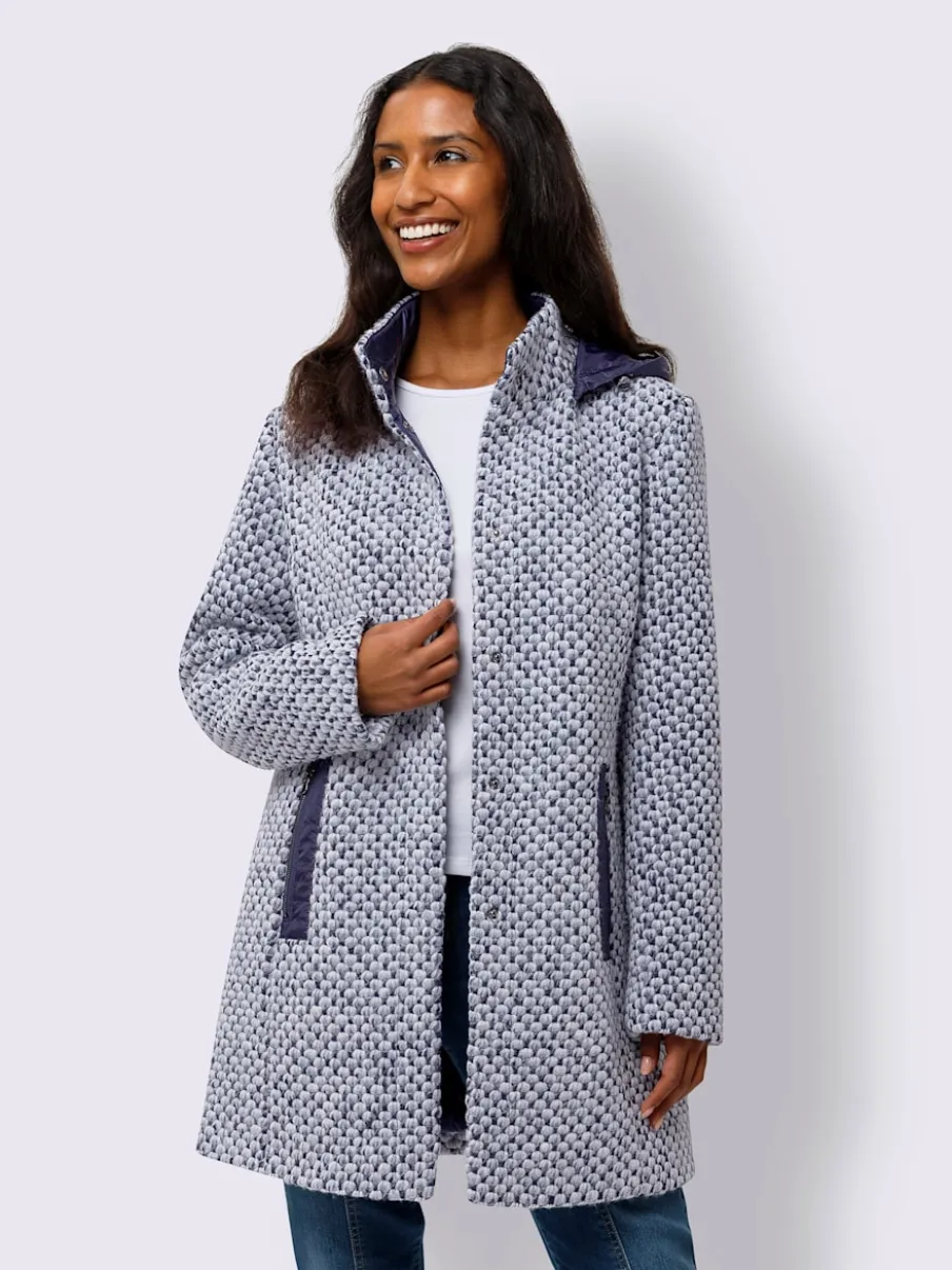 Veste d'extérieur avec capuche amovible et poches.