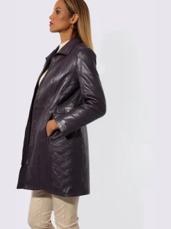 Veste en cuir d'agneau avec col convertible et empiècements affinants