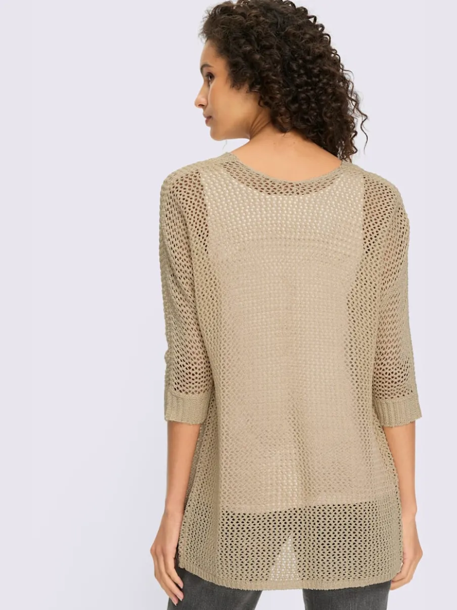 Veste en tricot ajouré avec manches chauve-souris et motif léger