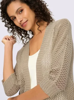 Veste en tricot ajouré avec manches chauve-souris et motif léger