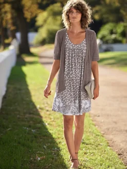 Veste en tricot ajouré à manches semi-longues ouvertes