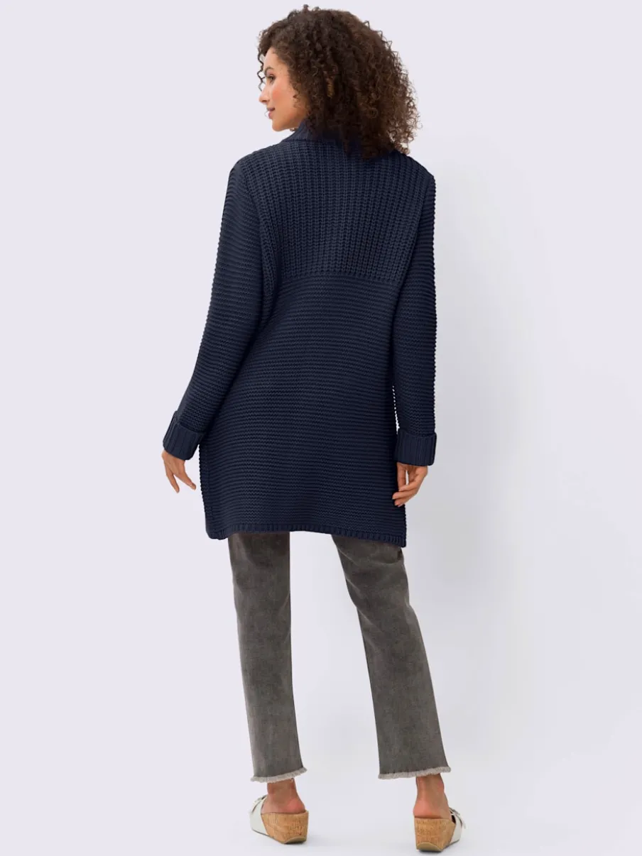 Veste en tricot avec col montant et poches fendues